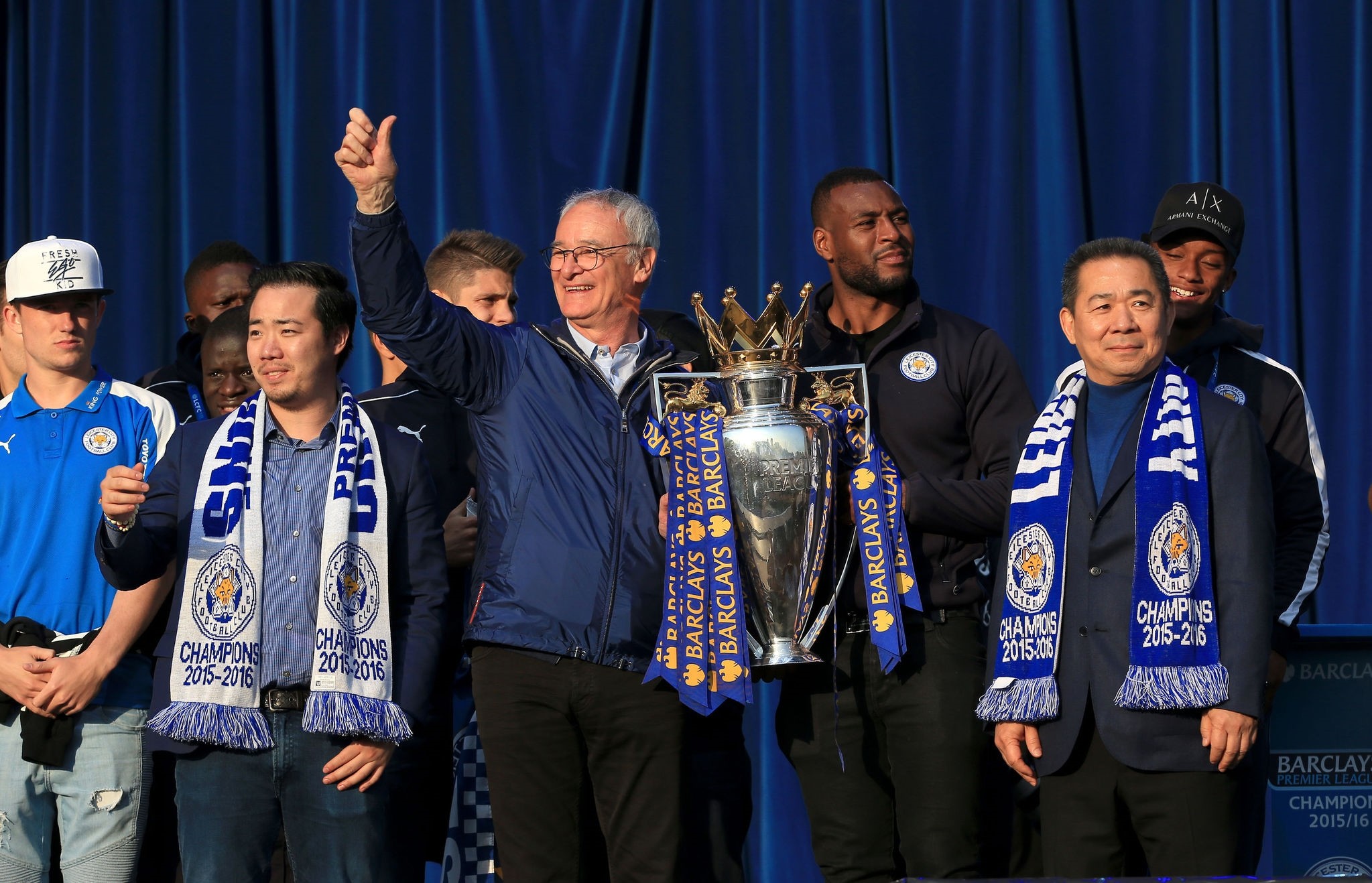 Leicester City's manager Claudio Ranieri holds the trophy alongside Chairman Vichai Srivaddhanaprabha (R) during celebrations for winning the English Premier league title at Victoria Park May 16, 2016. (AP Photo)