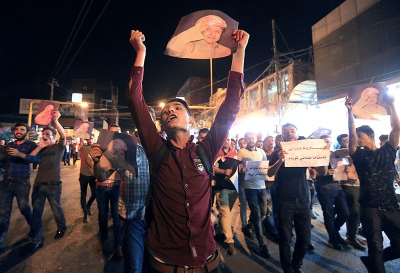 Demonstrators gather in the streets in support of Kurdish president Masoud Barzani on the night of the stabbing of one Kurdish journalist. (Reuters Photo)