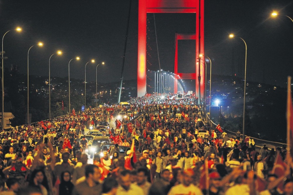 People walk over the Bosporus Bridge, now called the July 15 Martyrs' Bridge, in protest of FETu00d6's deadly coup attempt, Istanbul, July 21.