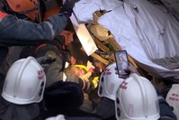 This handout picture released by The Russian Emergency Situations Ministry on January 1, 2019, shows emergency officers transporting a baby surviver after a gas explosion rocked a residential building in Magnitogorsk. (AFP Photo)