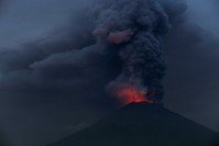 Glowing light of hot lava is seen during the eruption of Mount Agung as seen from Amed in Karangasem, Bali, Indonesia (Reuters File Photo)