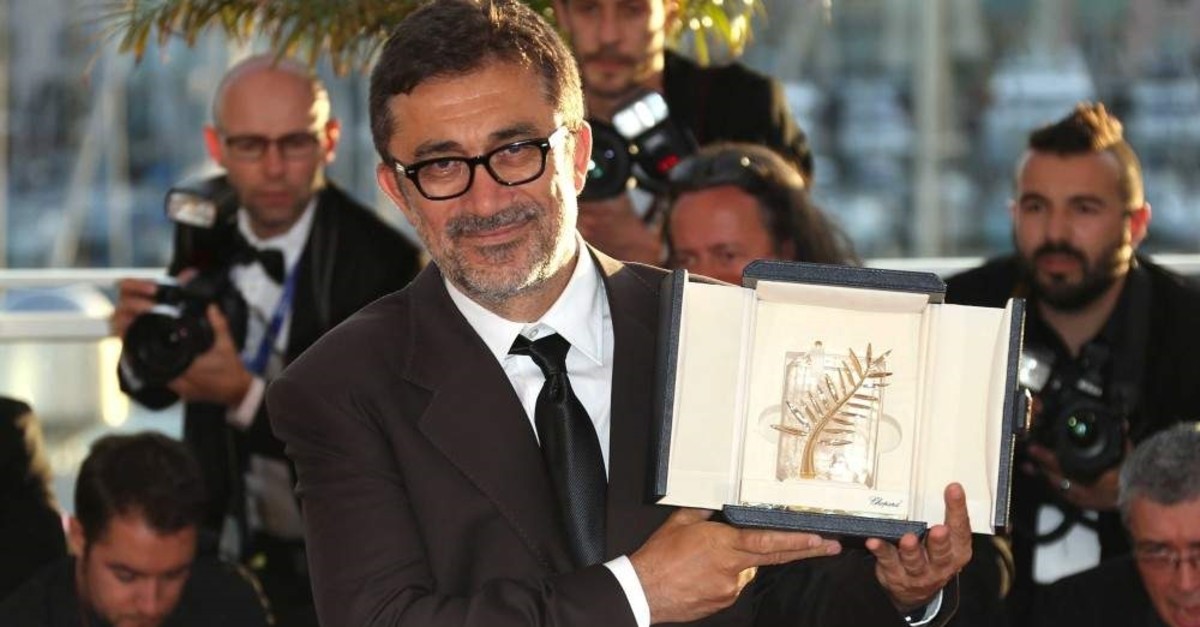Director Nuri Bilge Ceylan poses with the Palme d'Or award for the film ,Winter Sleep, at the 67th Cannes Film Festival on May 24, 2014. (AP Photo)