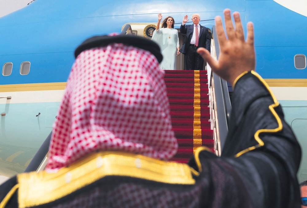 U.S. President Donald Trump and first lady Melania Trump wave as they board Air Force One before leaving Riyadh for Israel, May 22, 2017.