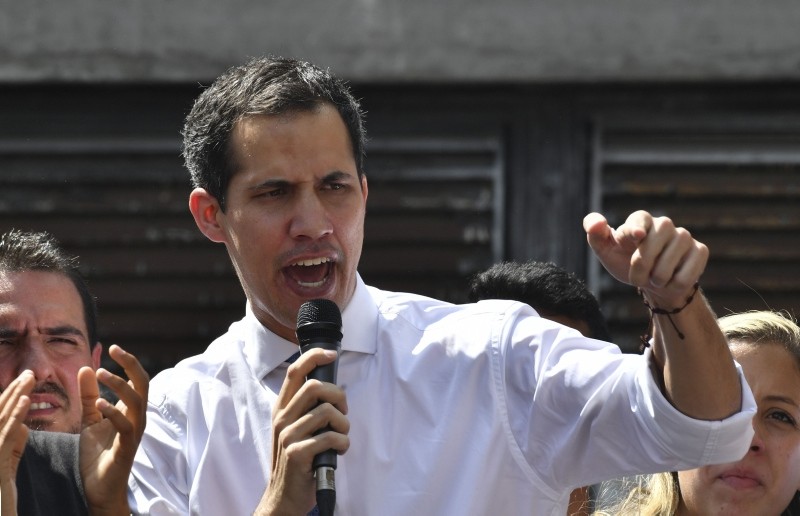 Venezuela's National Assembly president Juan Guaido speaks before a crowd of opposition supporters during an open meeting at the Central University of Caracas (UCV) in Caracas, Venezuela, Jan. 21, 2019. (AFP Photo)