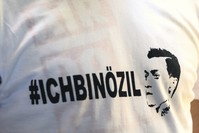 A T-shirt bearing the words ,I am u00d6zil, is worn by a protester during a demonstration against the German government's treatment of international football star Mesut u00d6zil, Germany.