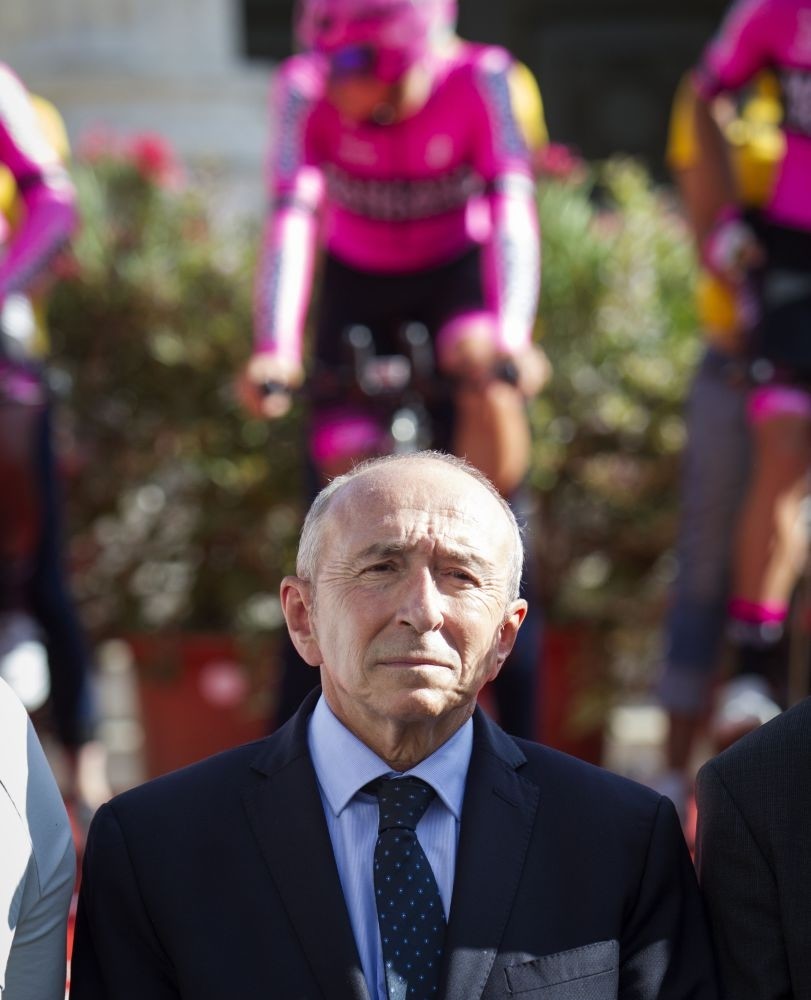French Minister of Interior Gerard Collomb stands during a minute's silence in solidarity with Barcelona following a vehicle attack on the city.