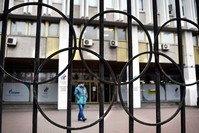 A man walks in front of the Russian Olympic Committee (ROC) headquarters, Moscow, Nov. 26, 2019. (AFP Photo) 