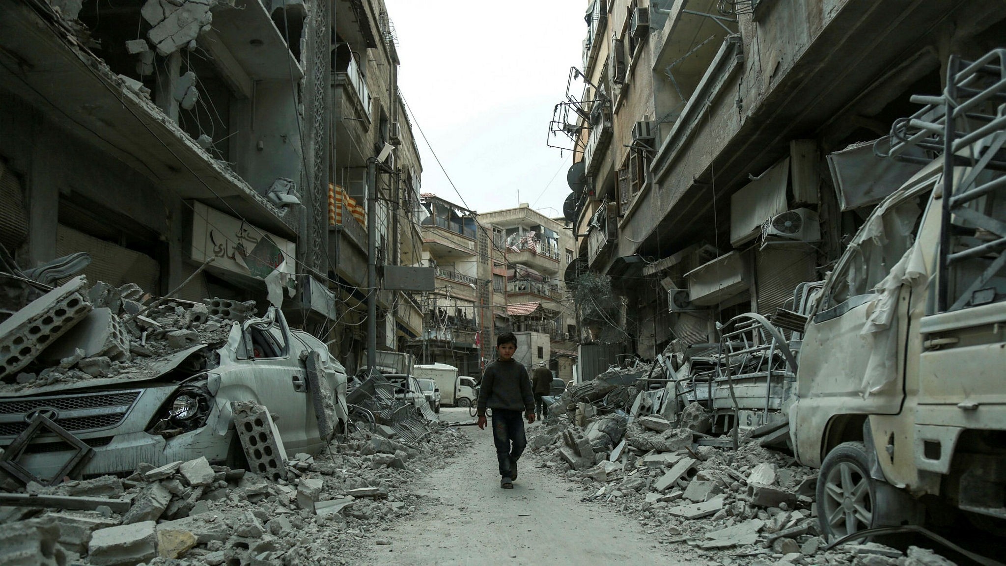 A Syrian child walks down a street in the opposition-held town of Douma, Eastern Ghouta, March 8.