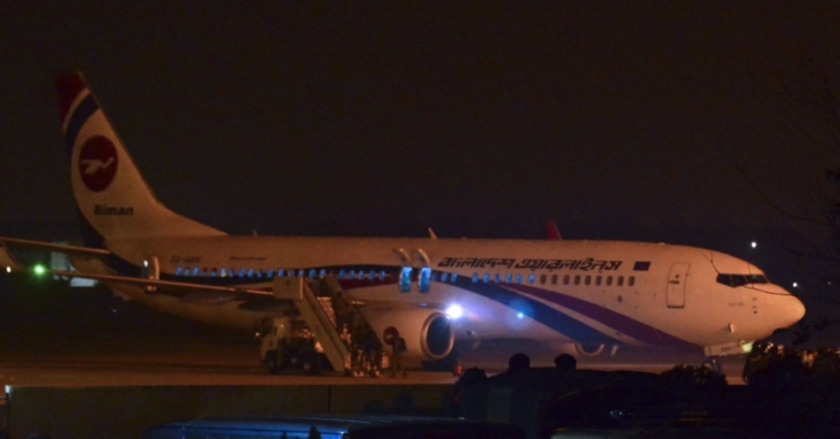 The hijacked Dubai-bound Bangladesh Biman plane is seen at the tarmac after an emergency landing at the Shah Amanat International Airport in Chittagong on February 24, 2019. (AFP Photo)