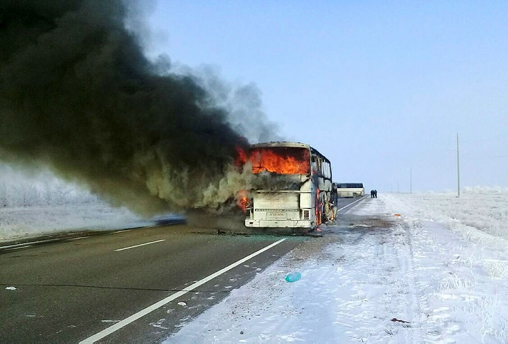 In this Kazakhstan Ministry for Emergency Situations photo, made available on Thursday, Jan. 18, 2018, a bus burns on a road in near the village of Kalybai in Kazakhstan. (AP Photo)