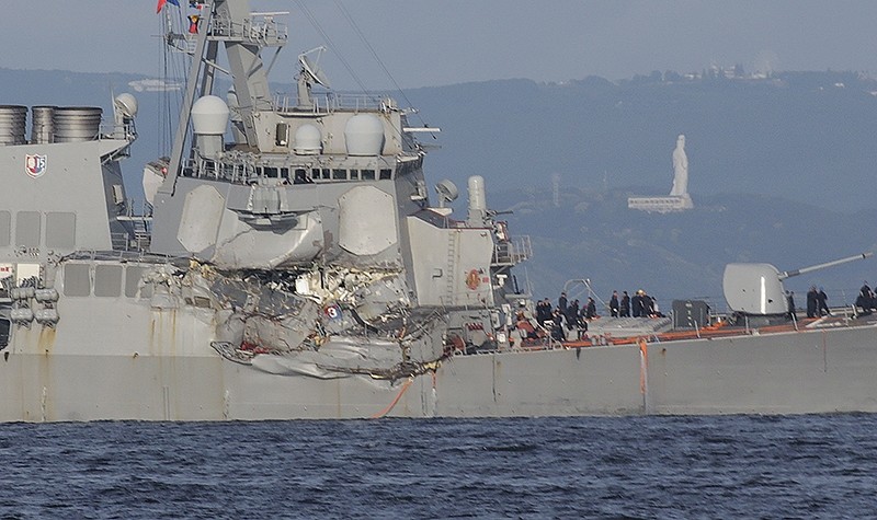 The damaged USS Fitzgerald is seen near the U.S. Naval base in Yokosuka, southwest of Tokyo, after the U.S. destroyer collided with the Philippine-registered container ship ACX Crystal in Japanese waters. (AP Photo) 
