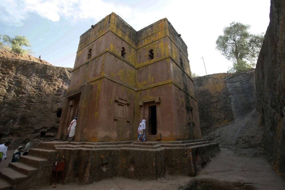 Priest in Bet Danaghel Church holding the Cross of King Lalibela. The  rock-hewn churches of Lalibela make it one of the greatest  Religio-Historical sites not only in Africa but in the Christian