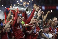 Liverpool's players celebrate with the trophy after winning the Champions League in Madrid, June 2, 2019. (AP Photo)