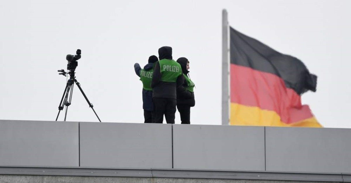 Police stand guard on the roof of the chancellery ahead of a conference on Libya in Berlin, Germany, Sunday, Jan. 19, 2020. (AP Photo)