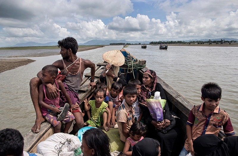 In this Oct. 2, 2017 photo, newly arrived Rohingya refugees on a boat towards a Bangladesh army run processing center where they will be allotted their camp, in Shah Porir Dwip, Bangladesh. (AP Photo)