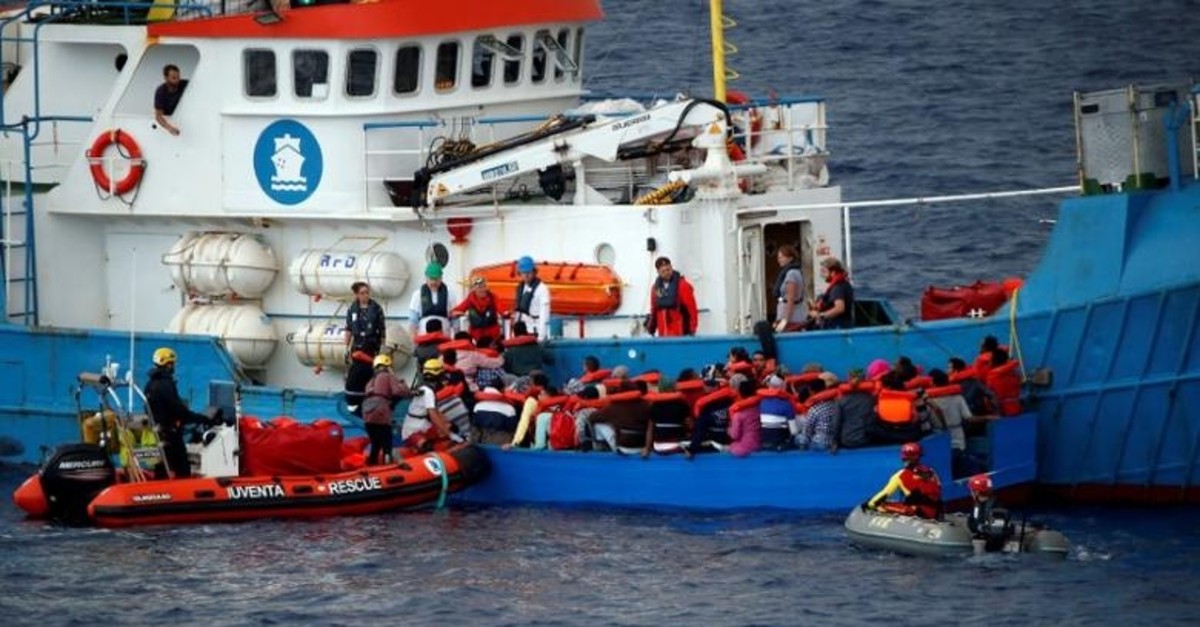 Migrants on a wooden boat are rescued by German NGO Jugend Rettet ship ,Juventa, crew in the Mediterranean sea off Libya coast, June 18, 2017. (Reuters Photo)