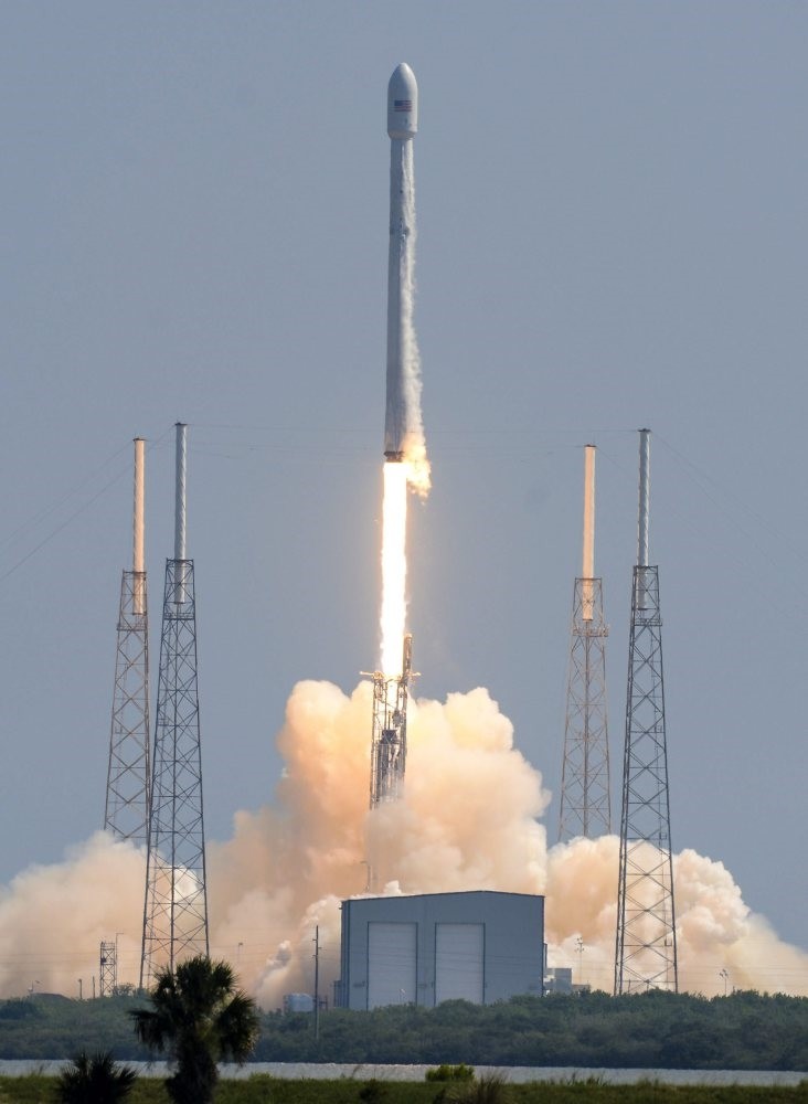 A SpaceX Falcon 9 rocket blasts off from Cape Canaveral Air Force Station, carrying a pair of satellites.