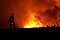 A California firefighter monitors the Medocino Complex fire.