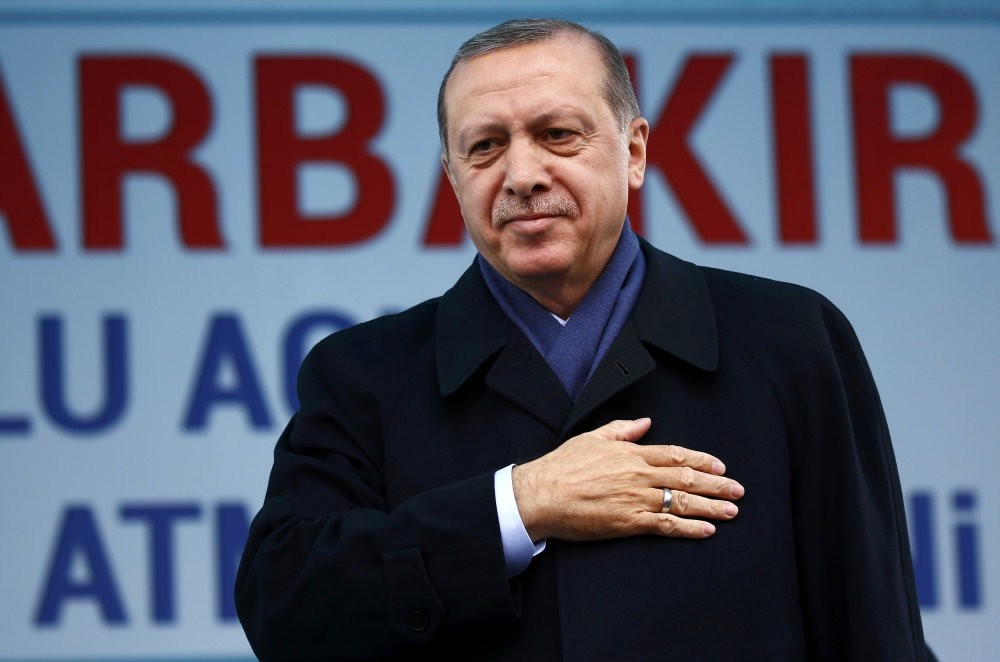 President Tayyip Erdou011fan greets his supporters during a rally for the referendum in the Kurdish-dominated southeastern city of Diyarbaku0131r, April 1.