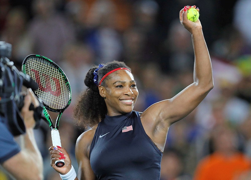 Serena Williams prepares to hit an autographed ball into the crowd at the 2016 Summer Olympics in Rio de Janeiro, Brazil. (AP Photo)