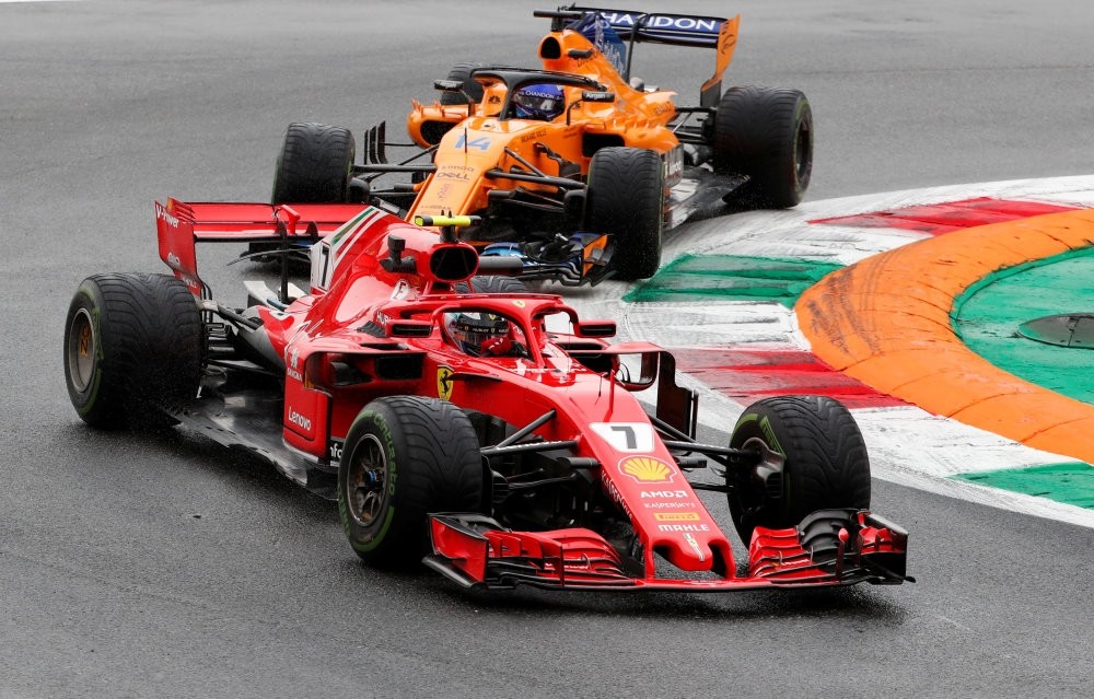 Ferrari's Kimi Raikkonen and McLaren's Fernando Alonso during practice in Monza, Aug. 31.