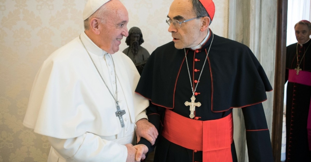 This handout photo taken and released on March 18, 2019 by the Vatican press office, the Vatican Media, shows Pope Francis shaking hands with France's Cardinal Philippe Barbarin (R), during their meeting at the Vatican on March 18, 2019. (AFP Photo)