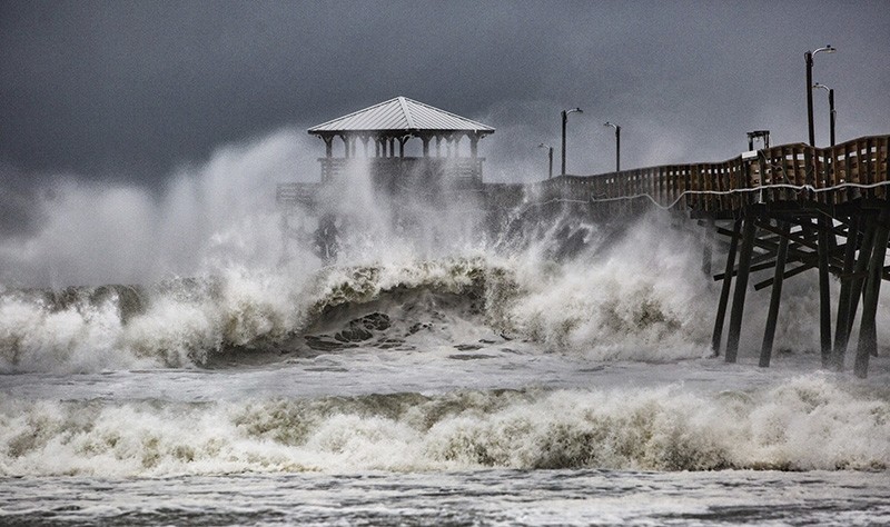 Waves slam the Oceana Pier & Pier House Restaurant in Atlantic Beach, N.C., Thursday, Sept. 13, 2018, as Hurricane Florence approaches the area. (AP Photo)
