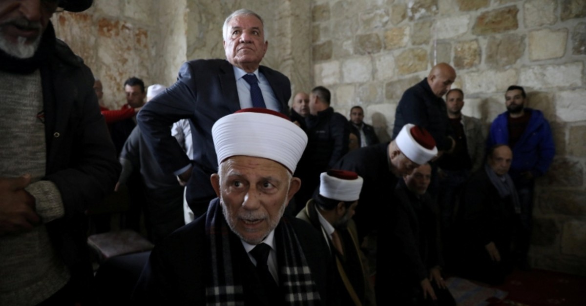 Chairman of the Waqf Council, Abdel-Azeem Salhab, attends Friday prayers together with other Palestinian Muslims inside the Golden Gate near Al-Aqsa Mosque in Jerusalem's Old City Feb. 22 (Reuters Photo)