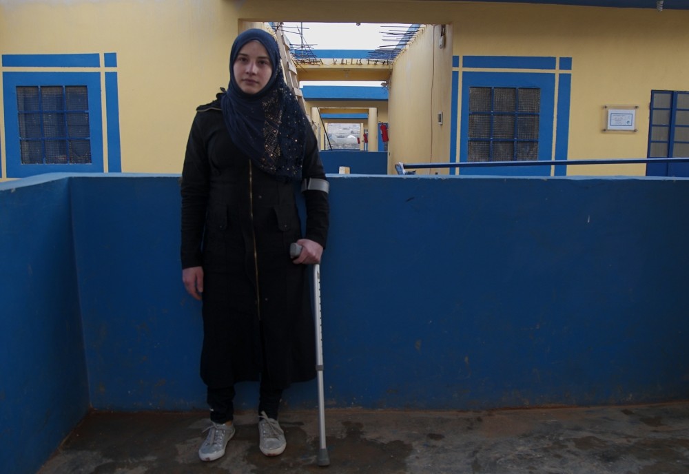 Fida Hassan poses with her new prosthetic leg in the camp she stays at in Syria, Feb. 4, 2019. 