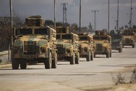 Turkish military convoy drives in Idlib province, Syria, Saturday, Feb. 22, 2020. (AP Photo/Ghaith Alsayed)