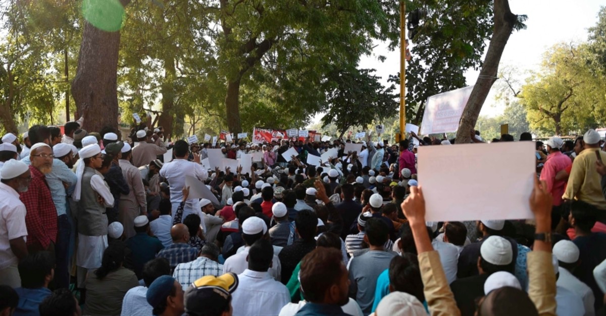 Muslim demonstrators hold placards as they participate in a peaceful protest against the Citizenship Amendment Bill (CAB) and the National Register of Citizens (NRC) in Ahmedabad on December 15, 2019. (AFP Photo)