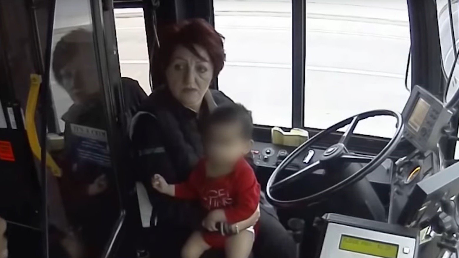 Screengrab from video shows driver Irena Ivic with the toddler inside the bus.