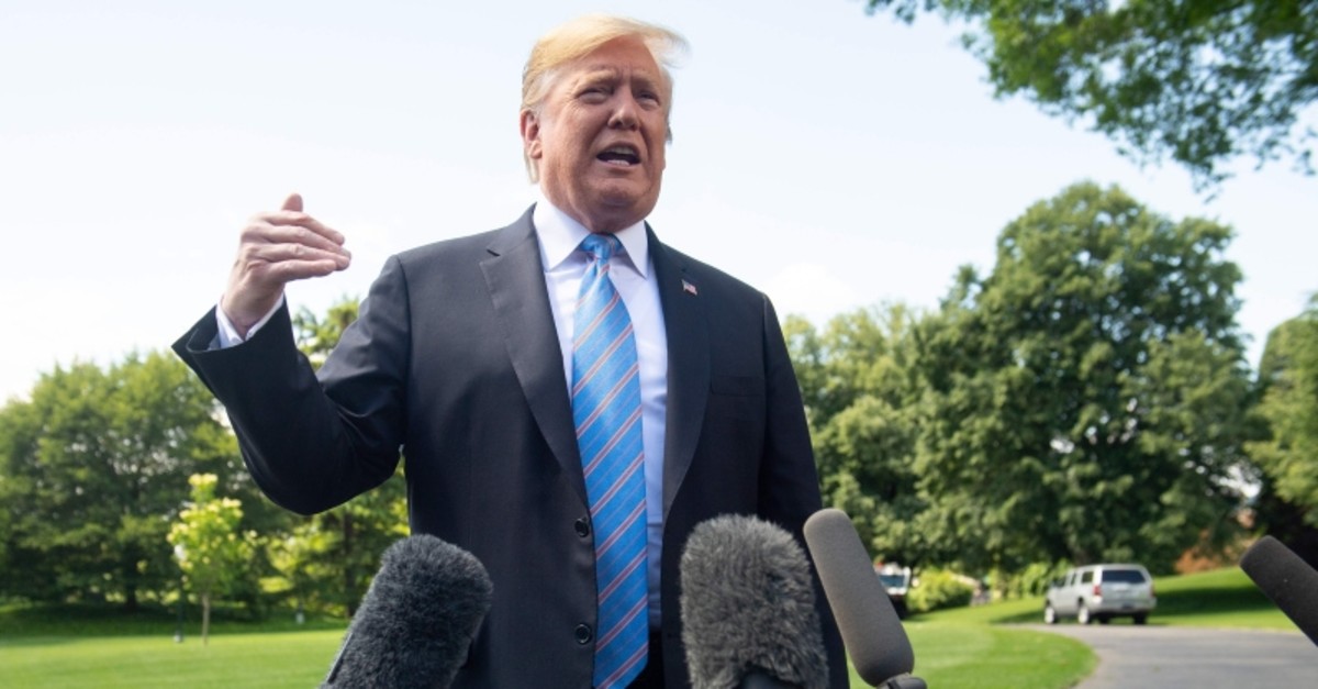 U.S. President Donald Trump speaks to the media prior to departing on Marine One from the South Lawn of the White House in Washington, DC, May 14, 2019. (AFP Photo)