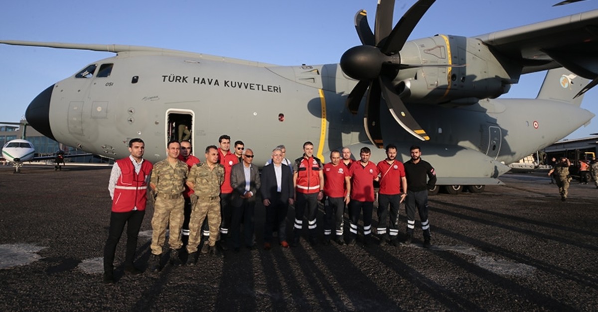 Turkish medical staff pose in front of the military aircraft ahead of their departure to Somalia on Tuesday, Jan. 21, 2020. (AA Photo)