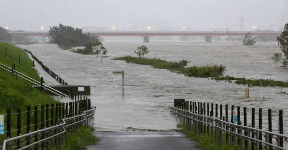 Swollen water levels along Tama river are pictured after heavy rains brought by approaching Typhoon Hagibis hit the Tokyo area on October 12, 2019 (AP Photo)