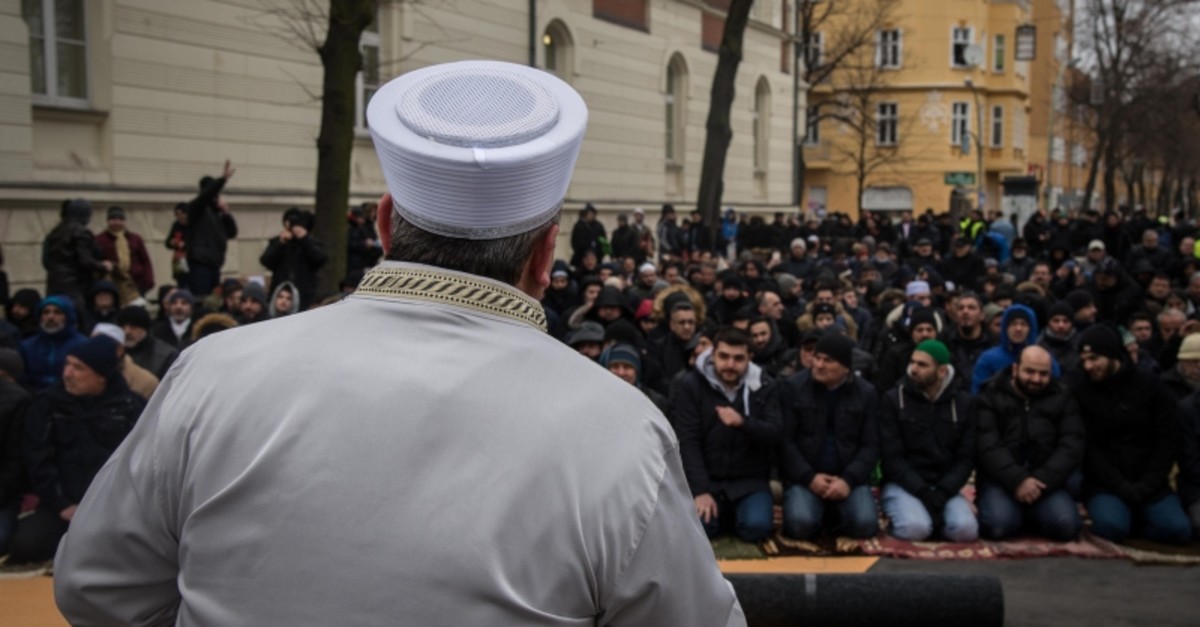 A Turkish imam addresses the Turkish-German community prior to Friday prayer in the street in front of the Koca Sinan Mosque in Berlin, March 16, 2018. (Sabah File Photo)