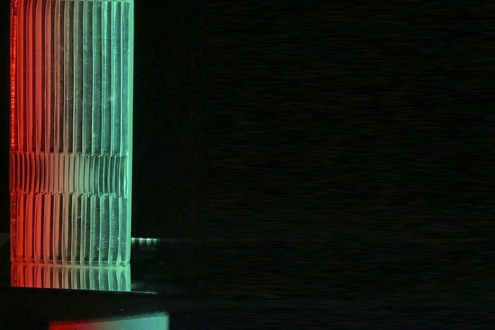 Zeynep Budak comments on the relationship between Istanbul and the night through buildings, reflections and light symbols.