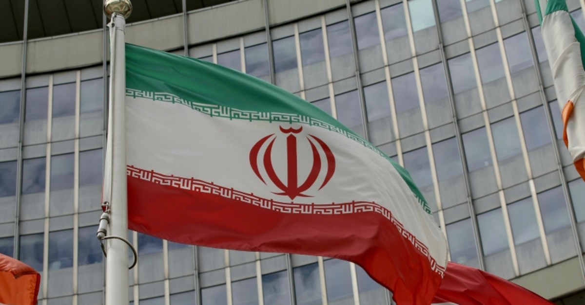 The Iranian flag waves outside of the UN building that hosts the International Atomic Energy Agency, IAEA, office inside in Vienna, Austria, Wednesday, July 10, 2019 (AP Photo)