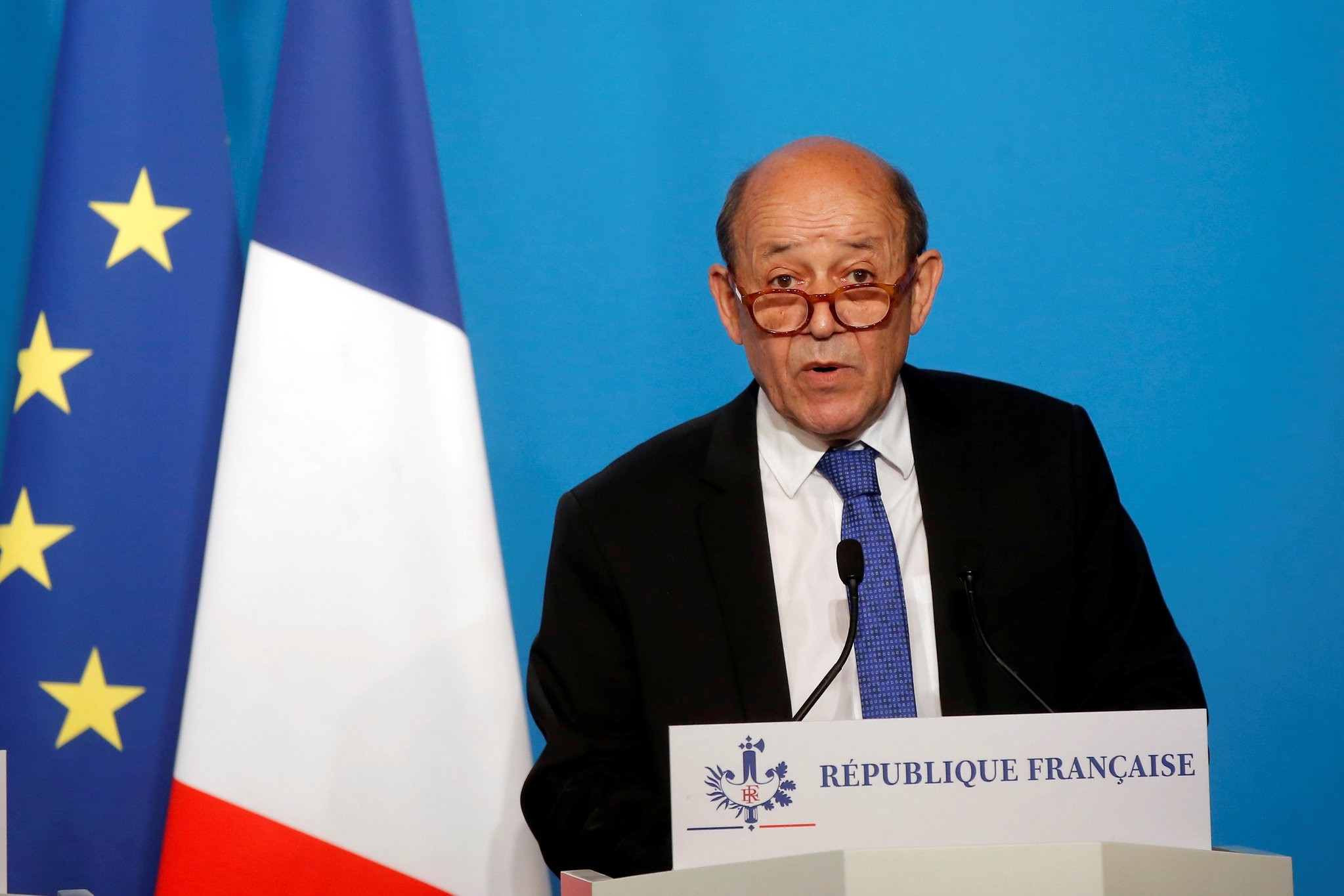 French Minister for Foreign Affairs Jean-Yves Le Drian makes an official statement in the press room at the Elysee Palace, in Paris, France, April 14, 2018. (Pool via Reuters)