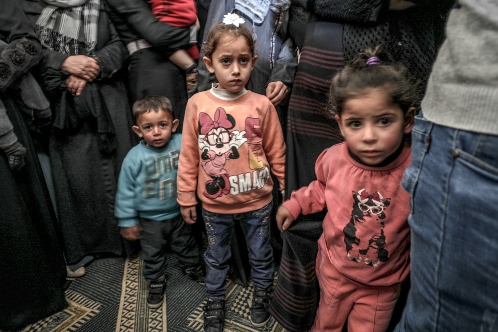Palestinians child relatives of four-year-old Ahmed Abu Abed look on during his funeral at east Khan Younis town in the southern Gaza Strip, Dec. 12.