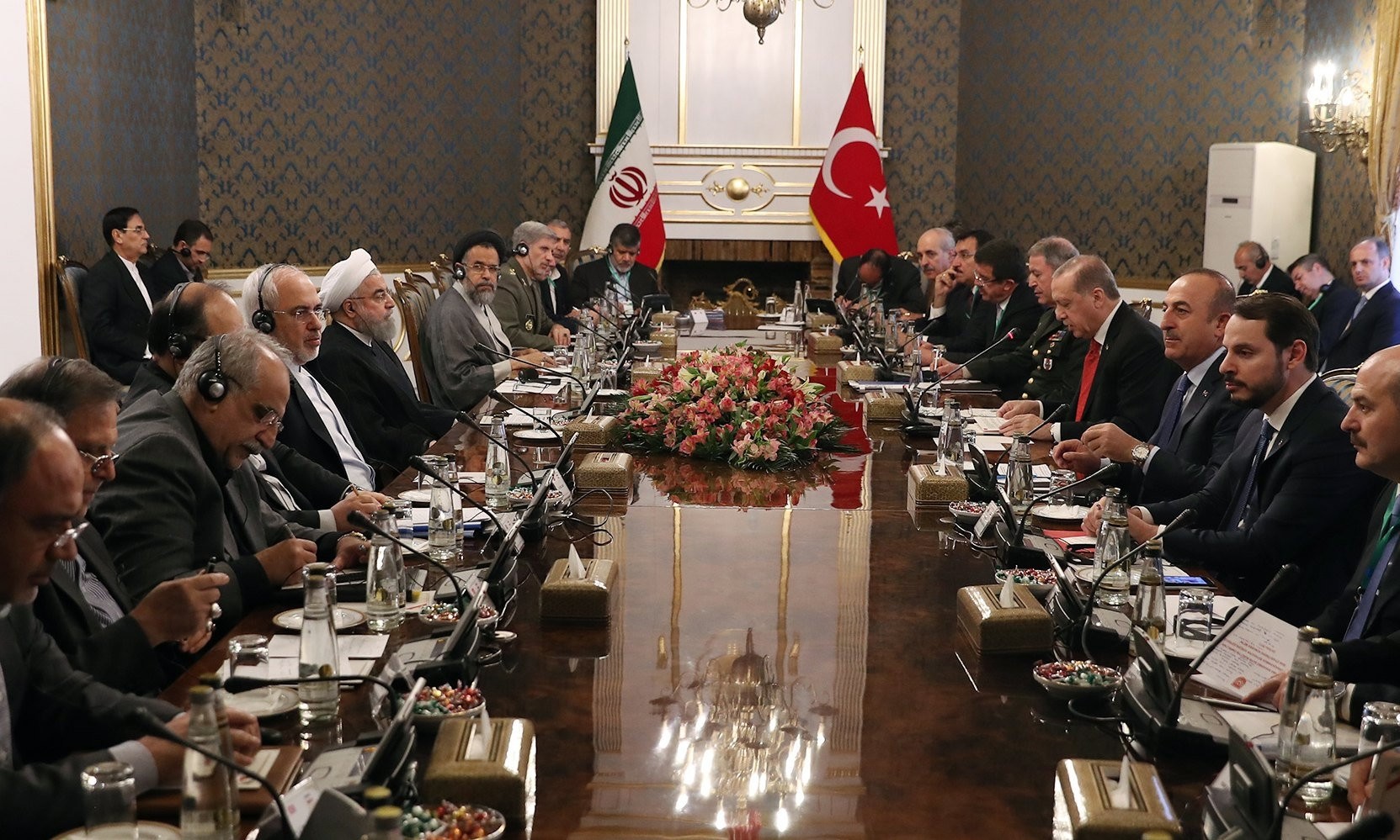 President Erdou011fan, accompanied by a Turkish delegation, speaks during a meeting with the Iranian president and his delegation in Tehran, Iran, Oct. 4. 