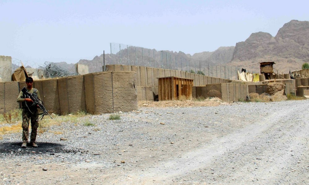 Afghan army soldier secures a military base after an attack by Taliban militants in the Arghandab district of Kandahar, southern Afghanistan, May 23.