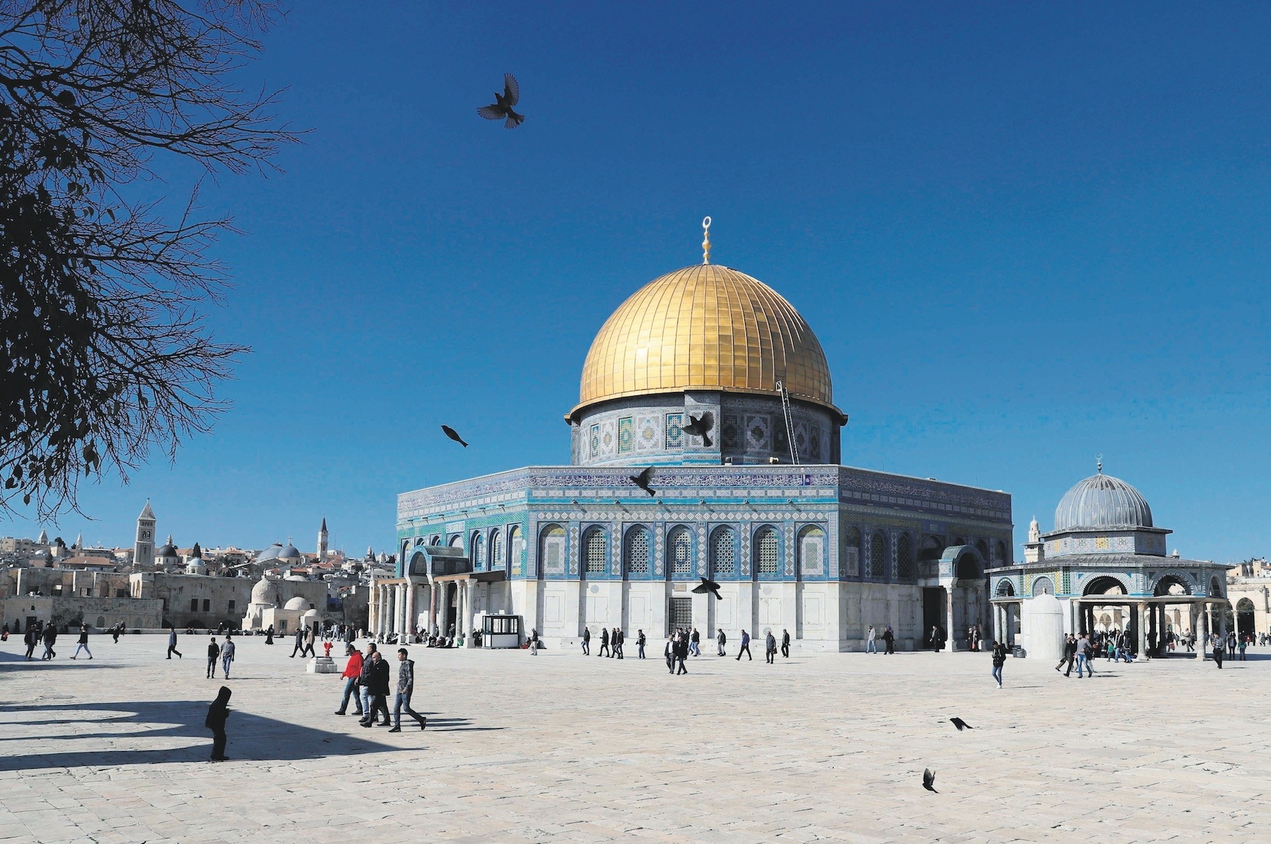 Palestinian Muslim worshippers walk past the Dome of the Rock at the Al-Aqsa Mosque compound in Jerusalemu2019s Old City after U.S. President Trumpu2019s decision to recognize Jerusalem as the capital of Israel.