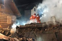 Firefighters work at the site of a building, leveled by a gas explosion, in the ski resort town of Szczyrk, Poland, Dec. 5, 2019, in this image obtained from social media. (Radio Bielsko via Reuters)