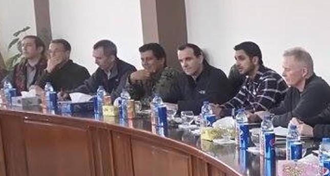 Trump’s special envoy to Deash (third from the right) sits side by side with the most wanted PKK terrorist Şahin Cilo at a meeting in Kobani in 2016.