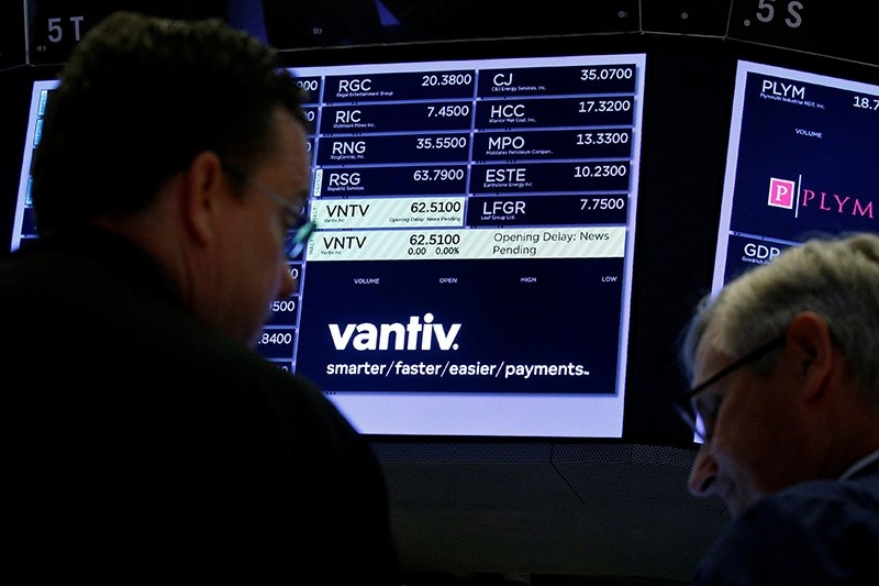 Traders wait for news at the post where U.S. credit card technology firm Vantiv Inc is traded on the floor of the New York Stock Exchange (NYSE) in New York, U.S., July 5, 2017. (Reuters Photo)