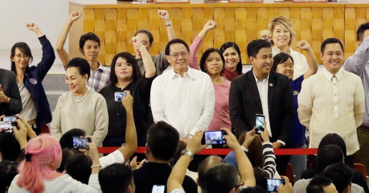 Left-wing group leaders raise their clenched fists during proclamation ceremonies for new representatives in metropolitan Manila, Philippines Wednesday, May 22, 2019. (AP Photo)