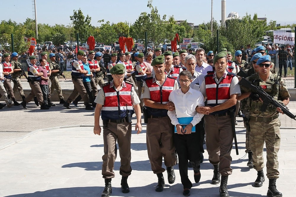 Soldiers escort Kemal Batmaz to the courthouse for a hearing of the main coup trial in Ankara.