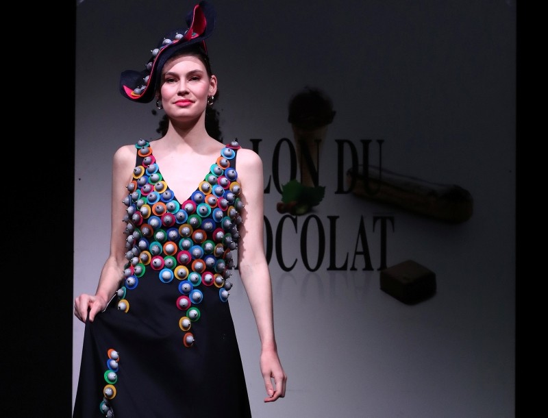 A model dressed in an outfit made with chocolate presents a creation at the
