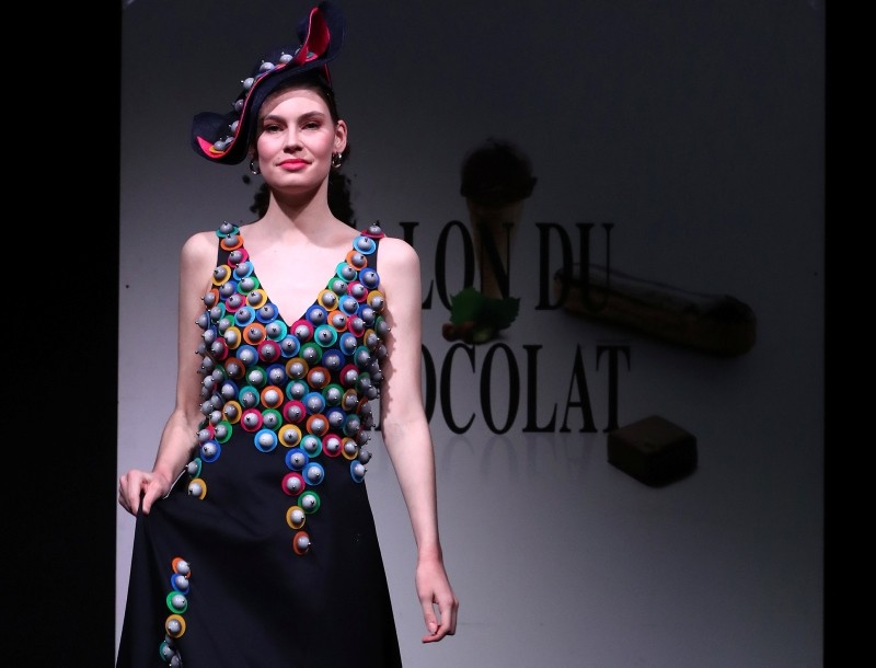 A model dressed in an outfit made with chocolate presents a creation at the 